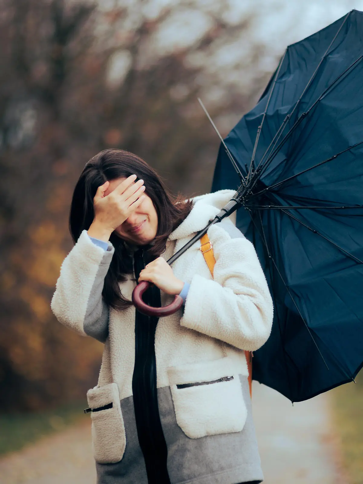 Stressed girl trying to go home during bad weather day
