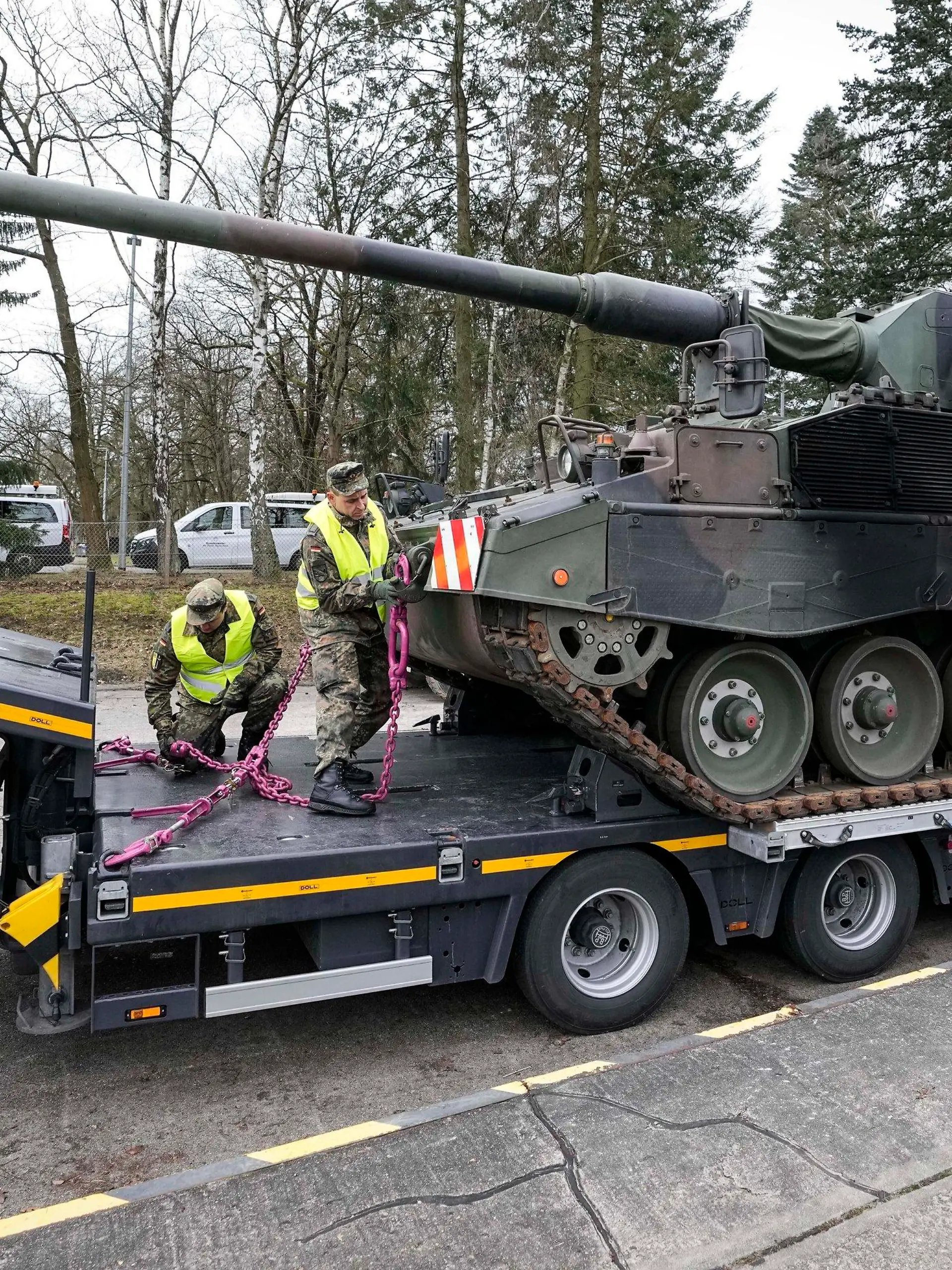 FILE - German soldiers load tank howitzers 2000 for transport to Lithuania at the Bundeswehr army base in Munster, northern Germany, Monday, Feb. 14, 2022. Germany's defense minister confirmed Friday that her country will supply Ukraine with seven powerful self-propelled howitzers to help defend itself against Russia. Christine Lambrecht said Ukrainian soldiers will be trained in Germany to use the self-propelled Panzerhaubitze 2000 artillery, which is capable of firing precision ammunition at a distance of up to 40 kilometers (25 miles). (AP Photo/Martin Meissner, File)