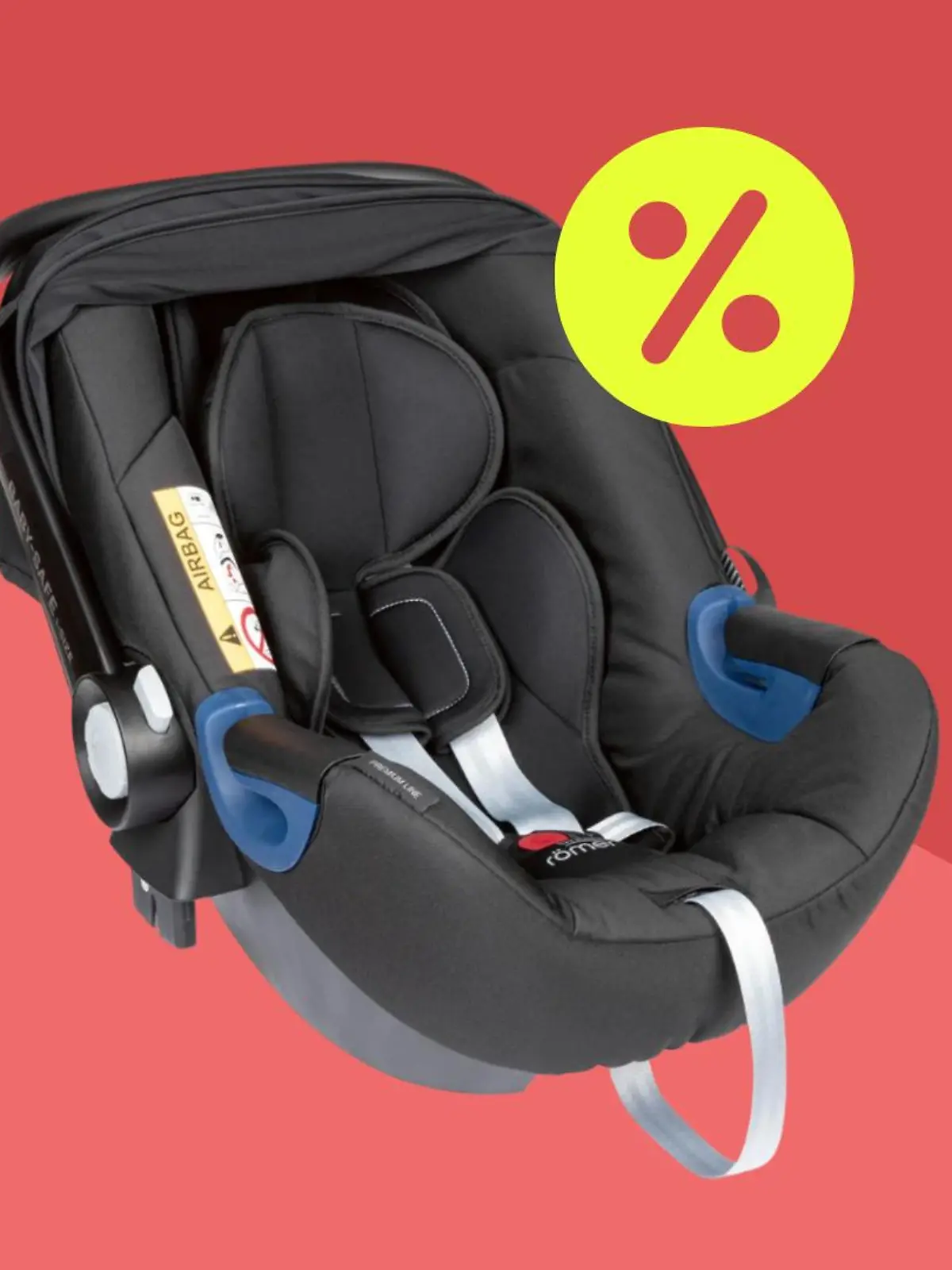 Die Britax Babyschale vor einem roten Hintergrund.