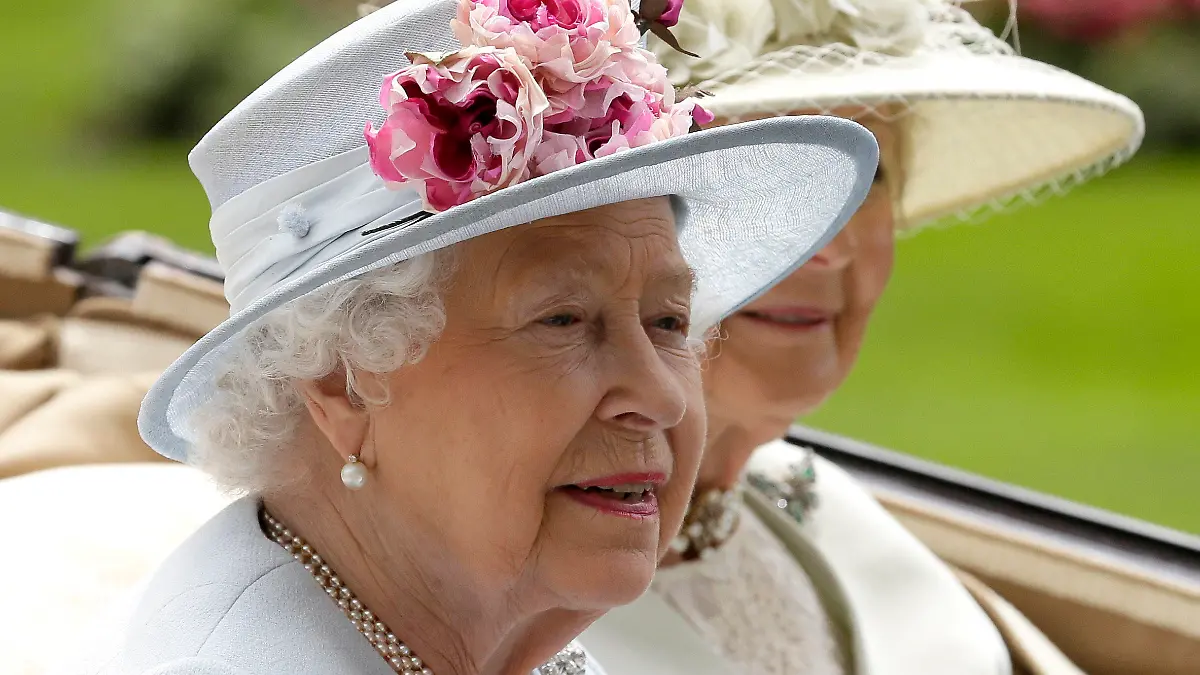FILE - Britain's Queen Elizabeth II arrives at the parade ring with Princess Alexandra in a horse drawn carriage, on the second day of the Royal Ascot horse race meeting in Ascot, England, Wednesday, June 20, 2018. Queen Elizabeth II is marking her 96th birthday privately on Thursday, April 21, 2022 retreating to the Sandringham estate in eastern England that has offered the monarch and her late husband, Prince Philip, a refuge from the affairs of state. (AP Photo/Tim Ireland, File)