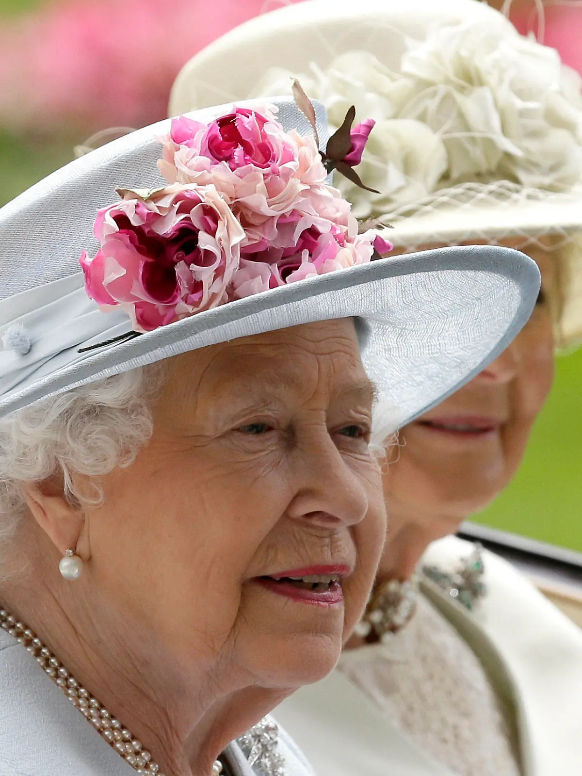 FILE - Britain's Queen Elizabeth II arrives at the parade ring with Princess Alexandra in a horse drawn carriage, on the second day of the Royal Ascot horse race meeting in Ascot, England, Wednesday, June 20, 2018. Queen Elizabeth II is marking her 96th birthday privately on Thursday, April 21, 2022 retreating to the Sandringham estate in eastern England that has offered the monarch and her late husband, Prince Philip, a refuge from the affairs of state. (AP Photo/Tim Ireland, File)