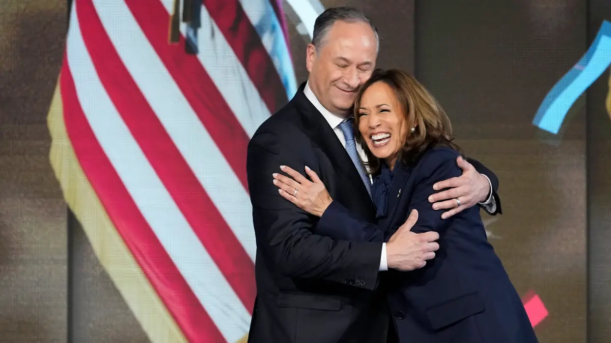 Aug 22, 2024; Chicago, IL, USA; Democratic presidential nominee Vice President Kamala Harris is joined on stage by second gentleman Doug Emhoff after she delivered an acceptance speech during the final day of the Democratic National Convention at the United Center.