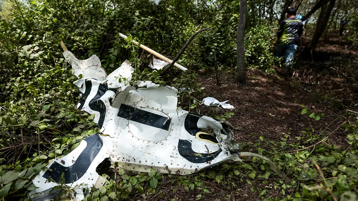 Rescue workers search the wreckage of a small aircraft a day after it crashed as five tourists from China and four Thais, including the two pilots, all presumed dead, in Bang Pakong, Chachoengsao province, Thailand, August 23, 2024.