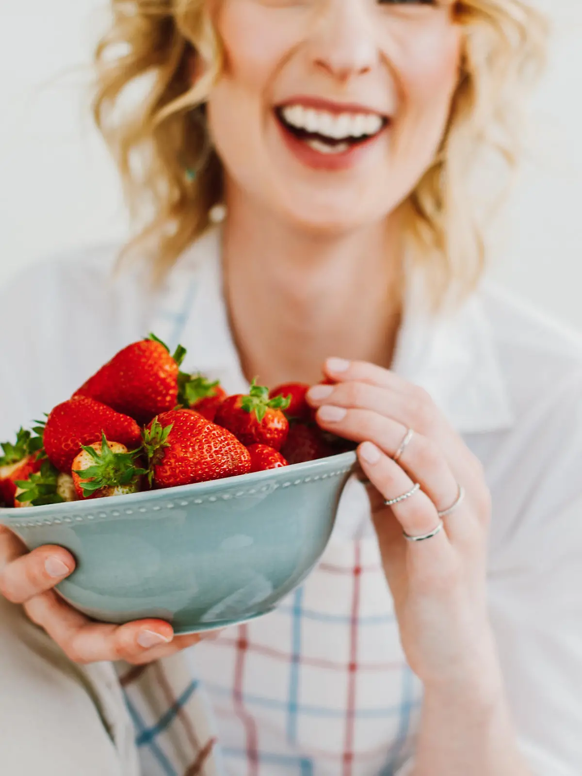 Young woman eating strawberries