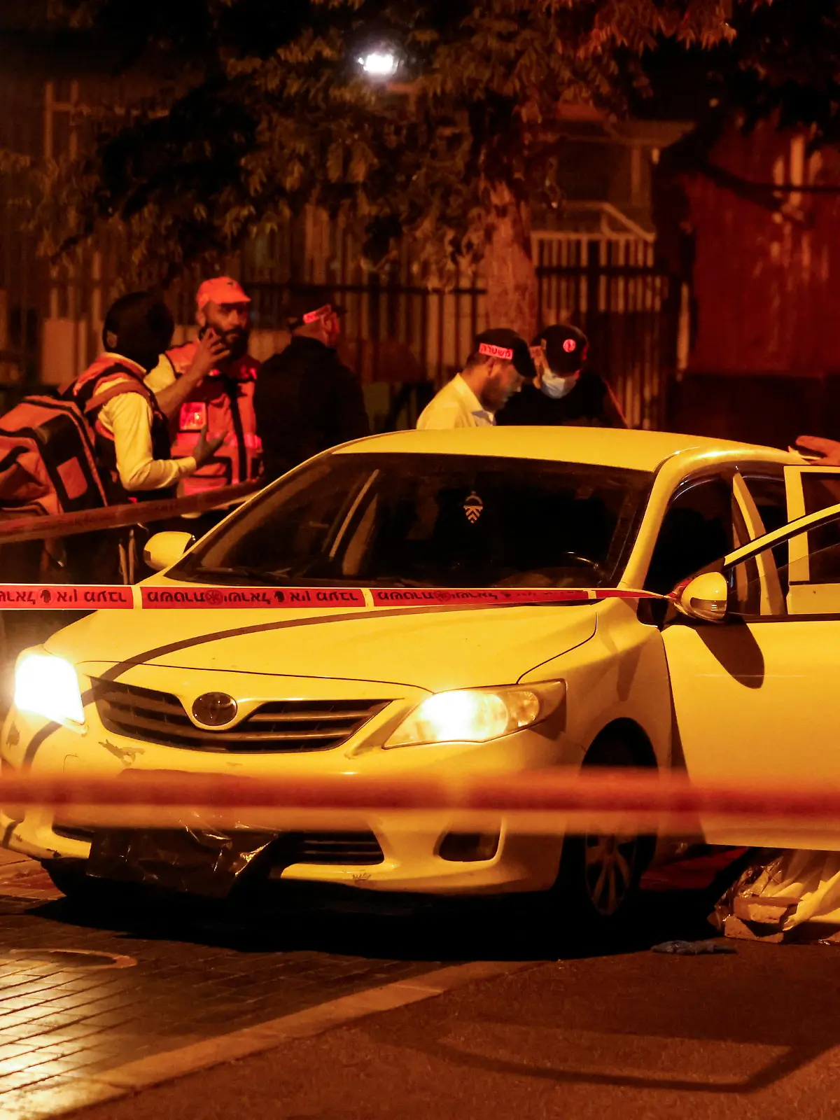 Israeli Security and rescue personnel work at the scene following an incident in Elad, in central Israel, May 5, 2022. REUTERS/Ammar Awad