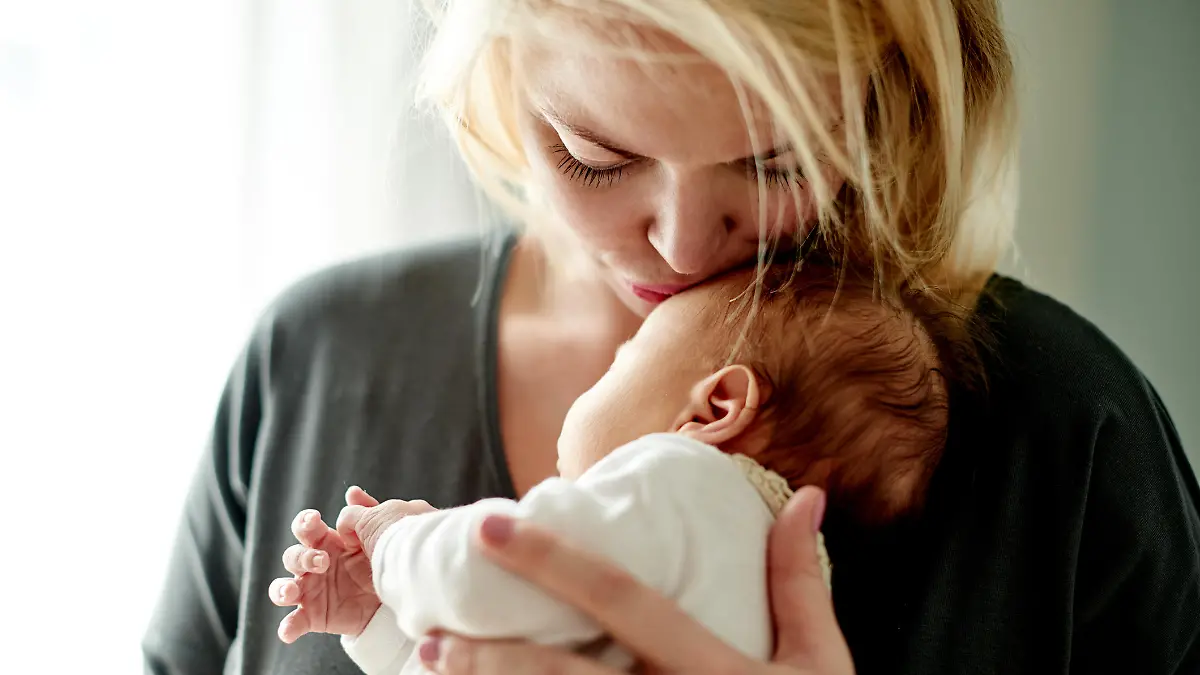 Shot of a mother spending time with her newborn baby