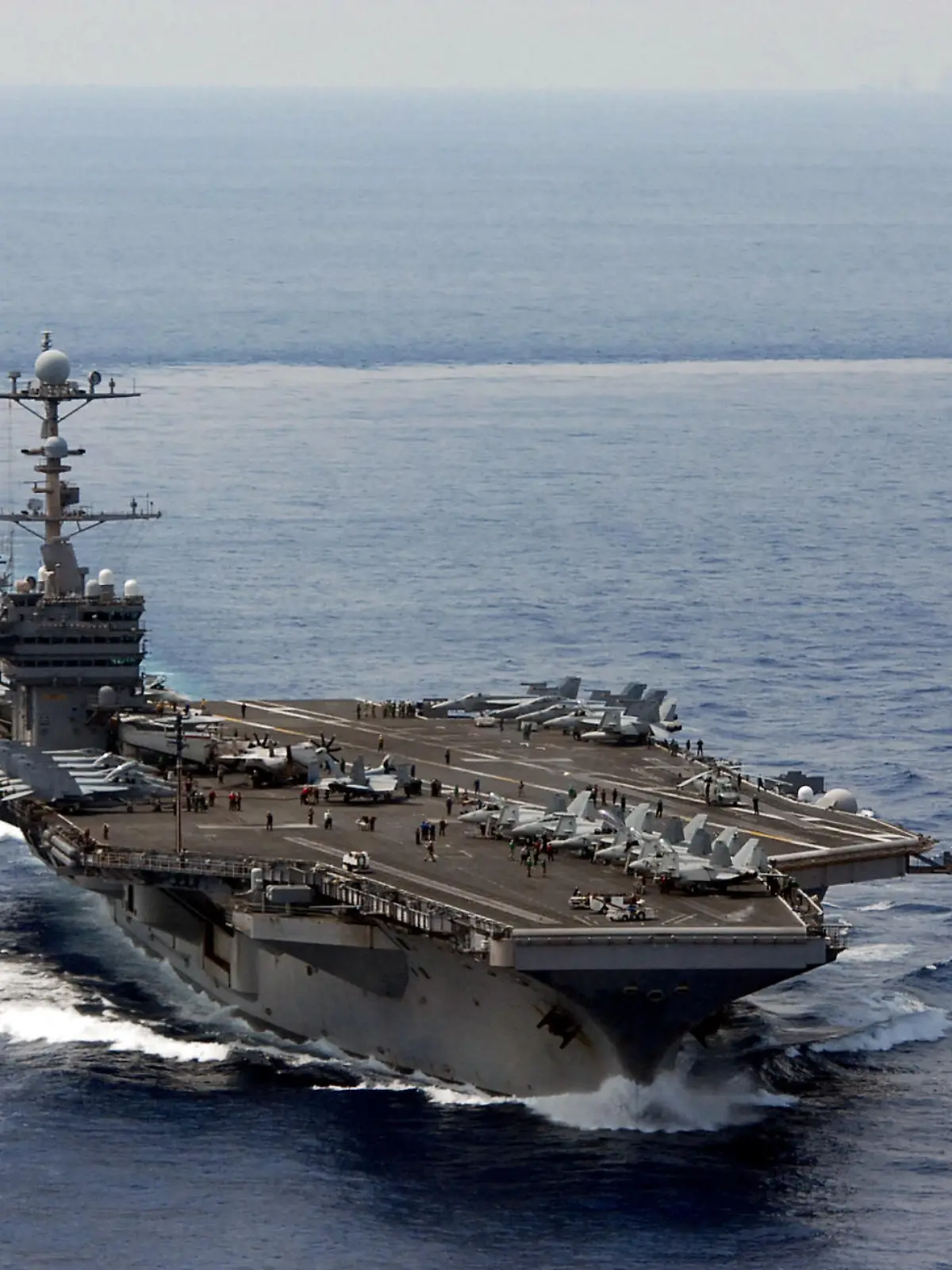 Handout file photo dated October 15, 2012 of the Nimitz-class aircraft carrier USS George Washington (CVN 73) is underway in the South China Sea. Three sailors from the USS George Washington aircraft carrier were found dead in less than one week, the Navy said, as the Naval Criminal Investigative Service and local authorities investigate the deaths. One sailor was found unresponsive on board the carrier last Friday, while two other sailors were found at off base locations on April 9 and 10. "While these incidents remain under investigation, there is no initial indication to suggest there is a correlation between these tragic events," said Cmdr. Reann Mommsen, a Navy spokeswoman. U.S. Navy photo by Chief Mass Communication Specialist Jennifer A. Villalovos via ABACAPRESS.COM