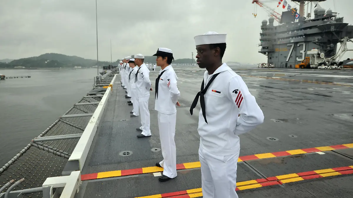 Handout file photo dated June 26, 2013 of sailors assigned to the aircraft carrier USS George Washington (CVN 73) man the rails as the ship gets underway in the Pacific Ocean. Three sailors from the USS George Washington aircraft carrier were found dead in less than one week, the Navy said, as the Naval Criminal Investigative Service and local authorities investigate the deaths. One sailor was found unresponsive on board the carrier last Friday, while two other sailors were found at off base locations on April 9 and 10. "While these incidents remain under investigation, there is no initial indication to suggest there is a correlation between these tragic events," said Cmdr. Reann Mommsen, a Navy spokeswoman. U.S. Navy photo by Mass Communication Specialist 3rd Class Ricardo R. Guzman via ABACAPRESS.COM