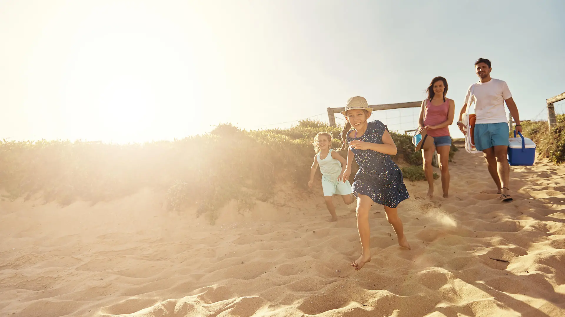 Shot of a young family arriving at the beachimage806237.jpg