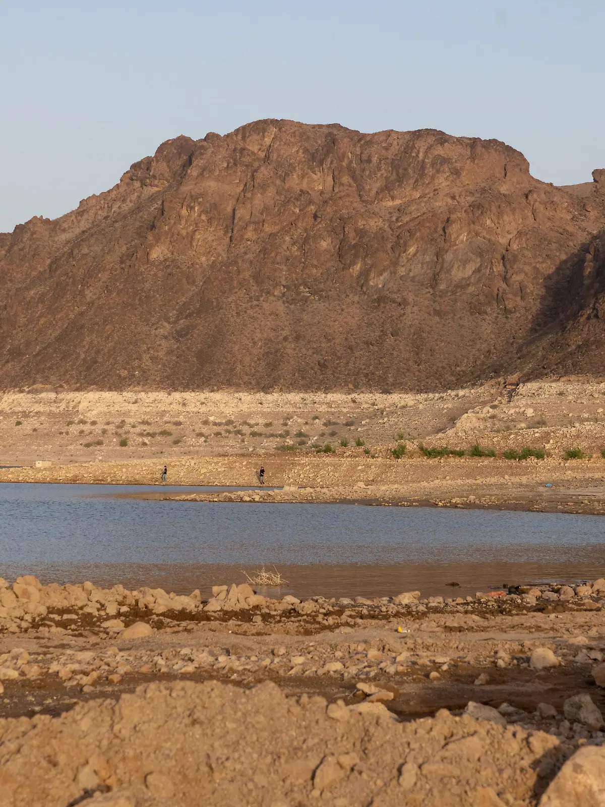 The sun sets on the shrinking Lake Mead, where water levels have declined dramatically to lows not seen since the reservoir was filled after the construction of Hoover Dam, as climate change and growing demand for its water shrink the Colorado River and create challenges, in Boulder City, Nevada, U.S., April 16, 2022. Picture taken April 16, 2022. REUTERS/Caitlin Ochs