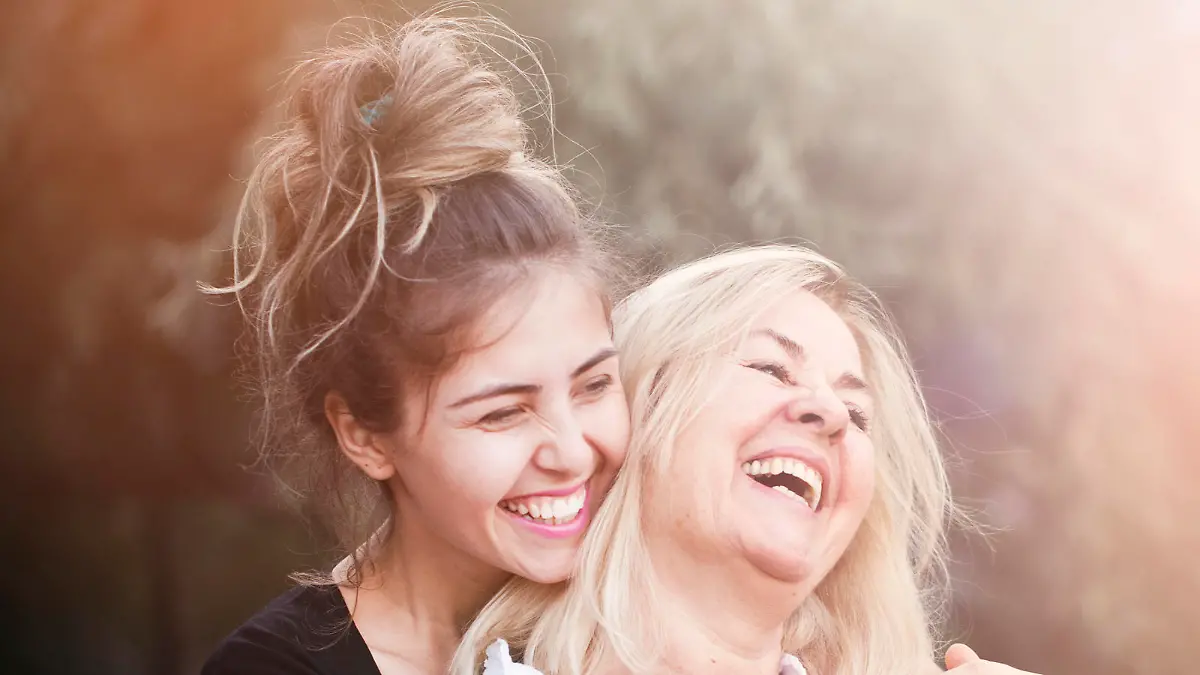 Smiling mother with young daughter