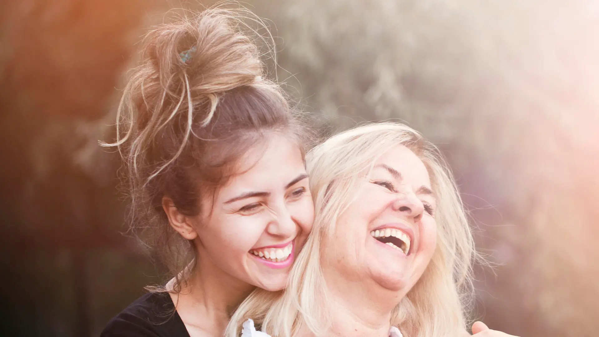 Smiling mother with young daughter