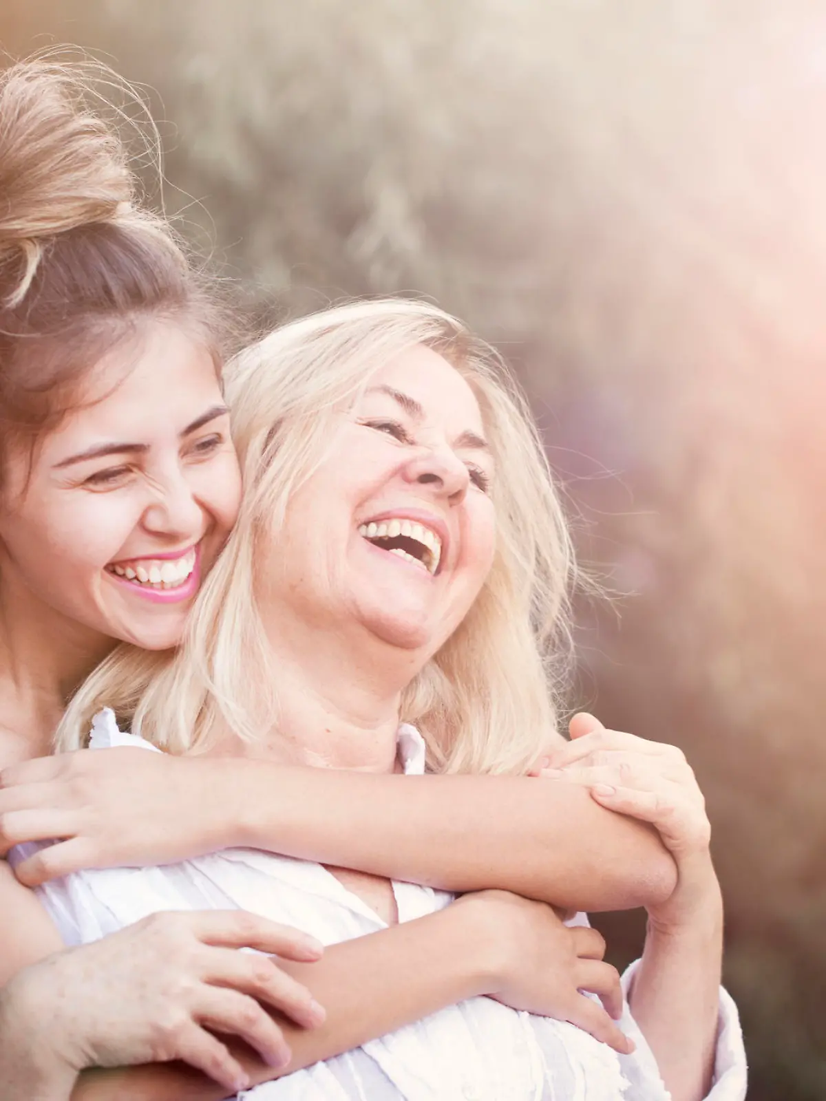 Smiling mother with young daughter
