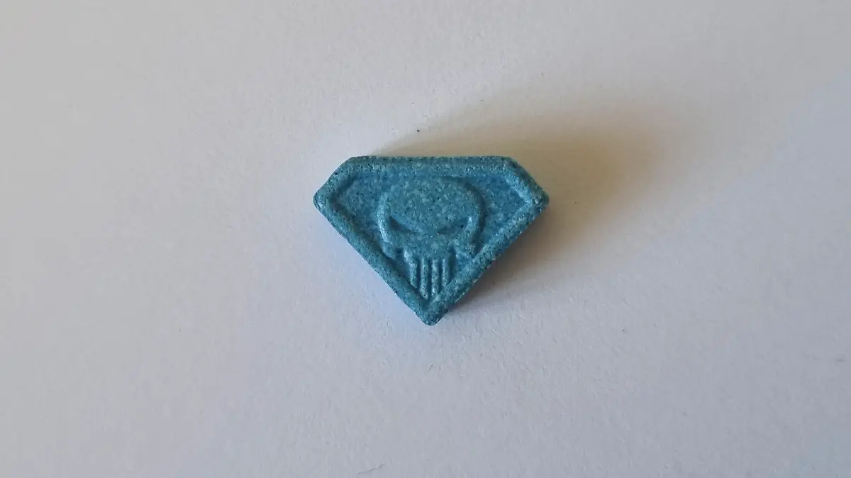 This undated handout photo provided on Wednesday, June 28, 2023 by the Neuhardenberg Police department shows a so-called 'Blue Punisher' ecstasy pill. German police have warned of a potentially lethal 'Blue Punisher' variety of ecstasy in circulation after the death of two teenage girls was linked to the drug. (Polizeipraesidium Neubrandenburg via AP)
