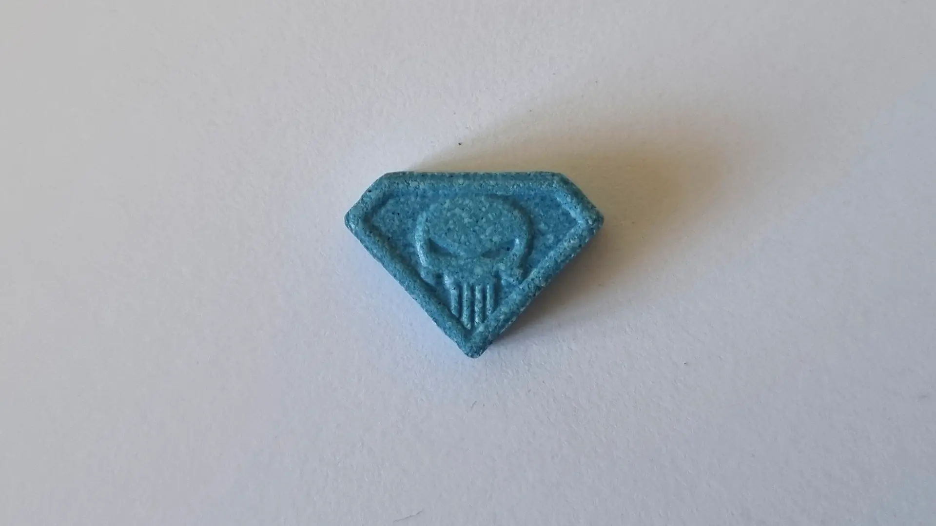This undated handout photo provided on Wednesday, June 28, 2023 by the Neuhardenberg Police department shows a so-called 'Blue Punisher' ecstasy pill. German police have warned of a potentially lethal 'Blue Punisher' variety of ecstasy in circulation after the death of two teenage girls was linked to the drug. (Polizeipraesidium Neubrandenburg via AP)