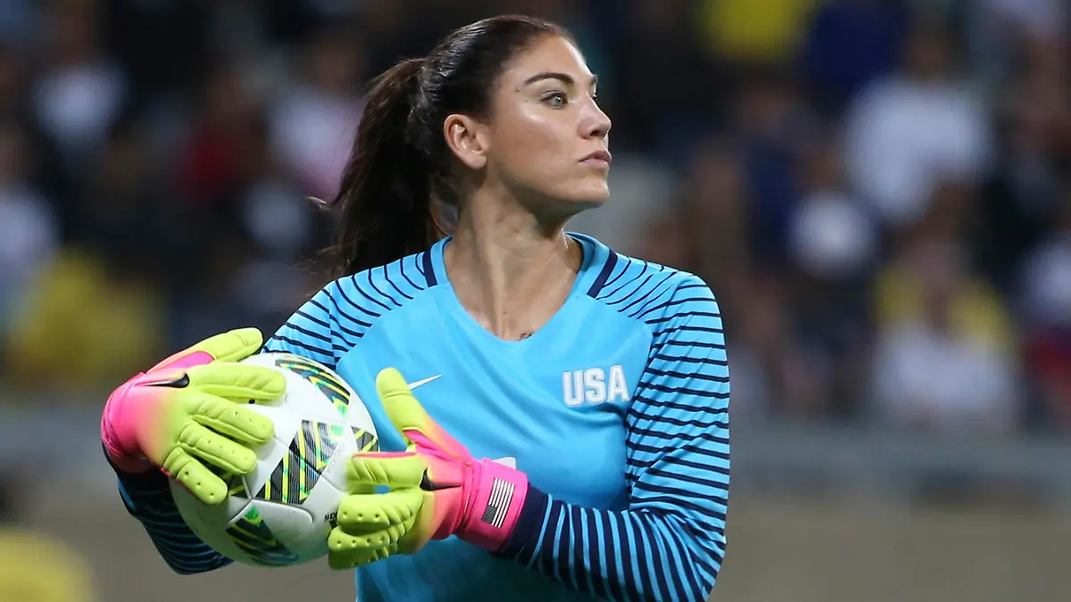 FILE - United States' goalkeeper Hope Solo takes the ball during a women's soccer game at the Rio Olympics against New Zealand in Belo Horizonte, Brazil, Aug. 3, 2016. Former U.S. women’s national team star goalkeeper Solo was arrested after police say she was found passed out behind the wheel of a vehicle in North Carolina with her two children inside. A police report said Solo was arrested on Thursday, March 31, 2022, in a shopping center parking lot in Winston-Salem and charged with driving while impaired, resisting a public officer and misdemeanor child abuse. (AP Photo/Eugenio Savio, File)