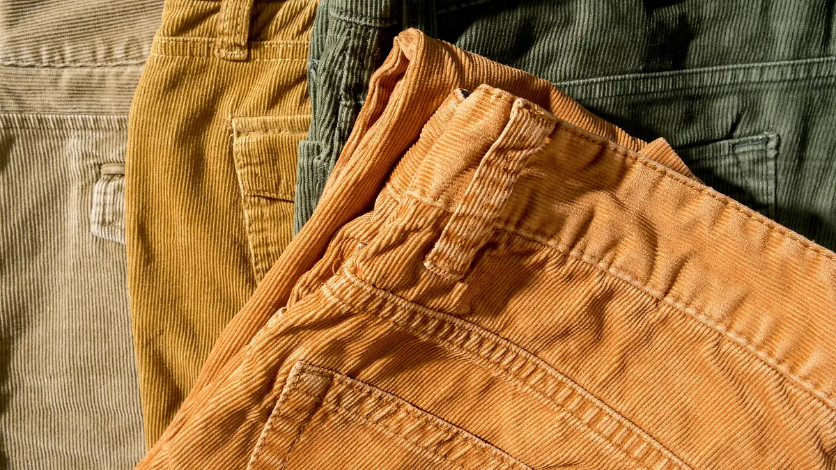 Corduroy trousers on sale in a boutique. Close-up. Top view.