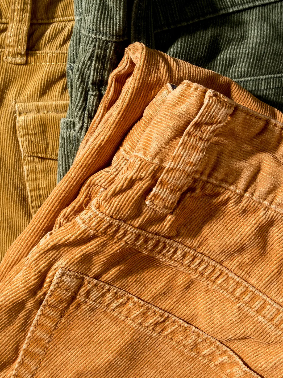 Corduroy trousers on sale in a boutique. Close-up. Top view.