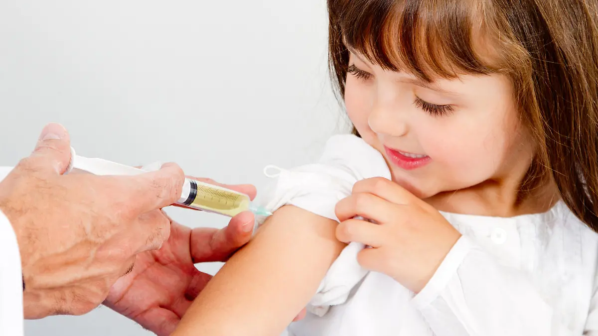 Girl getting a vaccine at the hospital