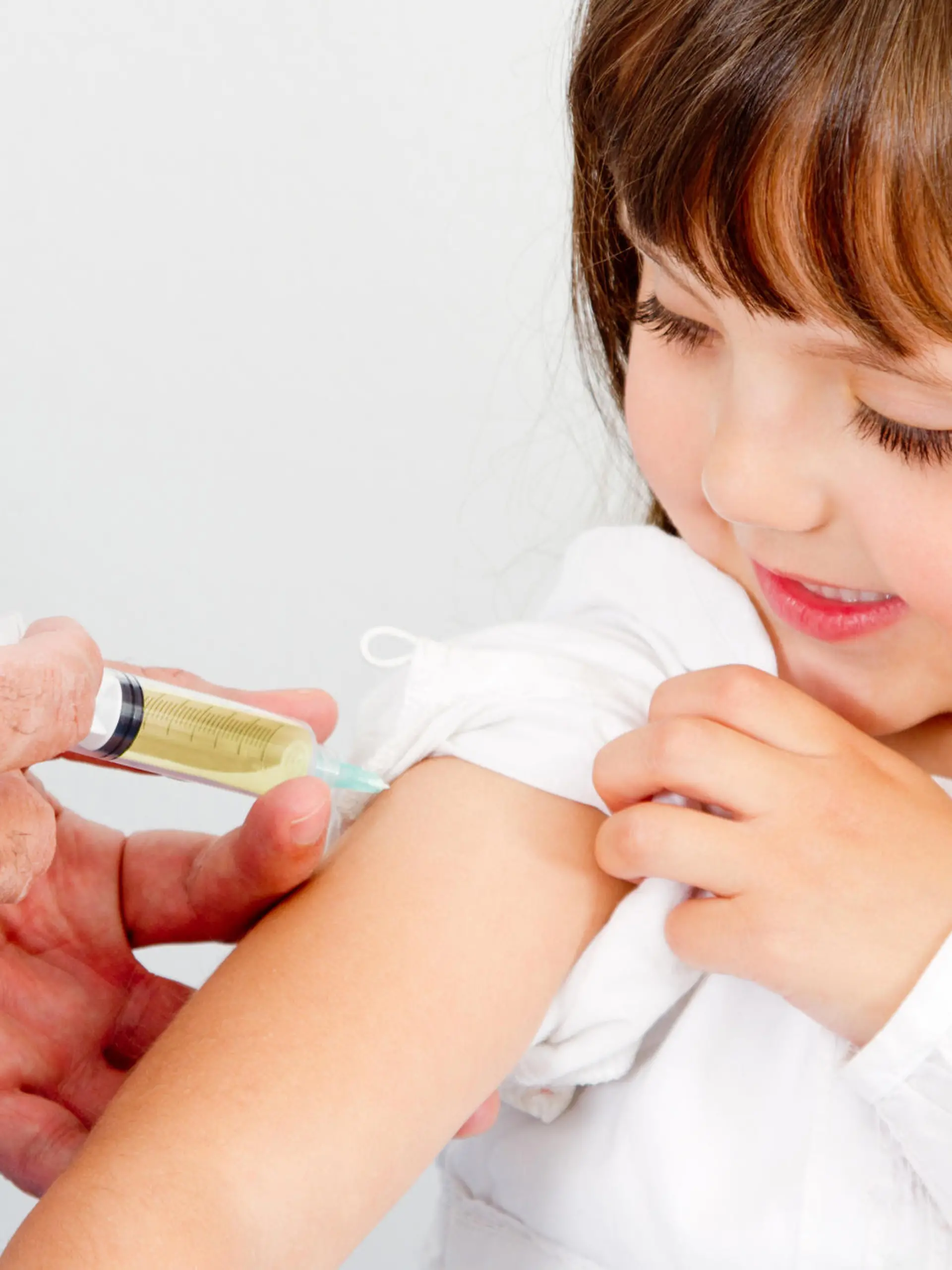 Girl getting a vaccine at the hospital