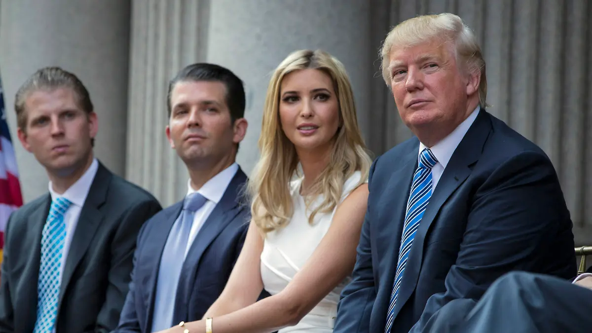 FILE - Donald Trump, right, sits with his children, from left, Eric Trump, Donald Trump Jr., and Ivanka Trump during a groundbreaking ceremony for the Trump International Hotel on July 23, 2014, in Washington. A New York appeals court dismissed Ivanka Trump on Tuesday, June 27, 2023, from a wide-ranging fraud lawsuit brought against her father and his company last year by the state's attorney general. (AP Photo/Evan Vucci, File)