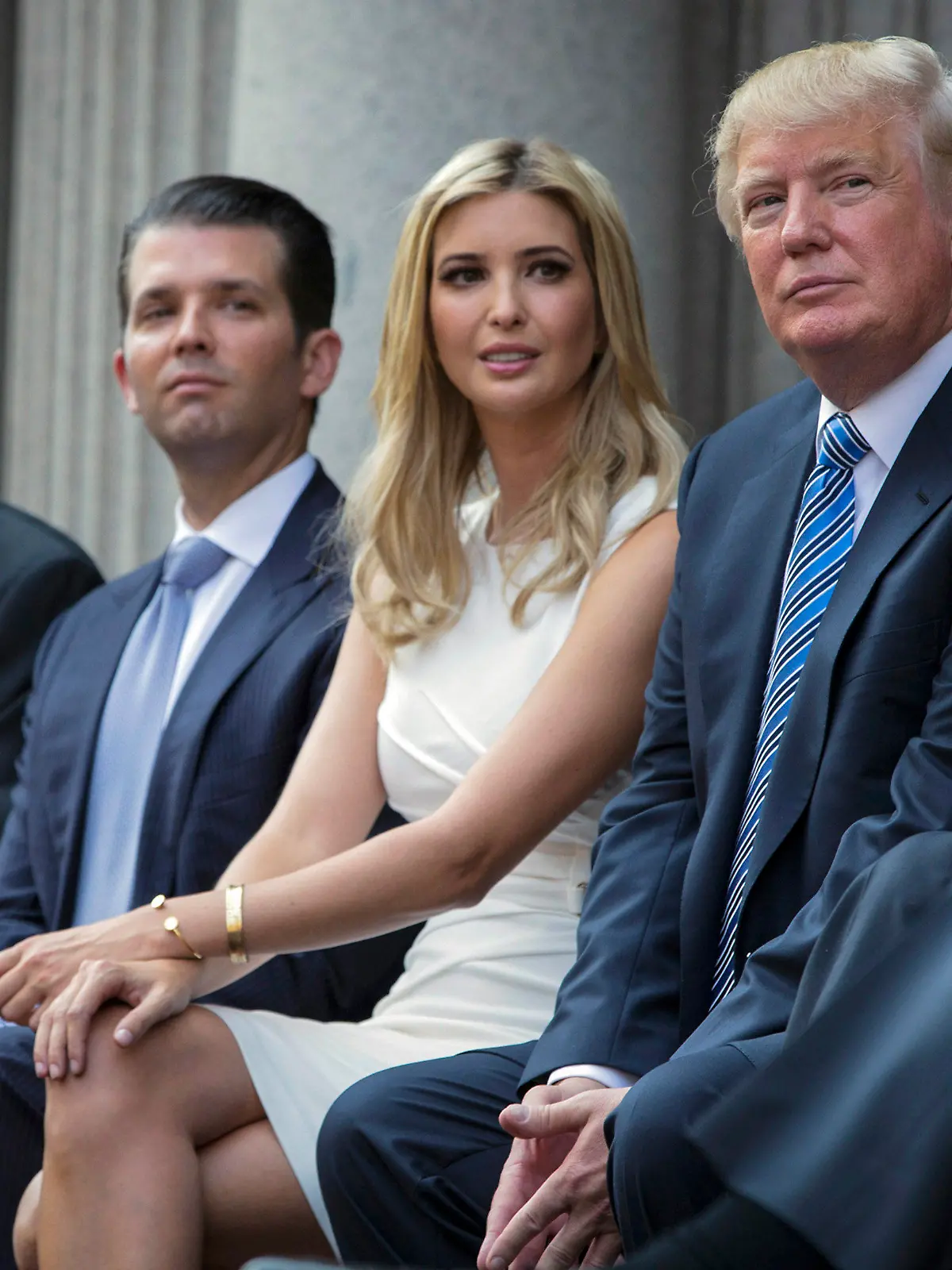 FILE - Donald Trump, right, sits with his children, from left, Eric Trump, Donald Trump Jr., and Ivanka Trump during a groundbreaking ceremony for the Trump International Hotel on July 23, 2014, in Washington. A New York appeals court dismissed Ivanka Trump on Tuesday, June 27, 2023, from a wide-ranging fraud lawsuit brought against her father and his company last year by the state's attorney general. (AP Photo/Evan Vucci, File)