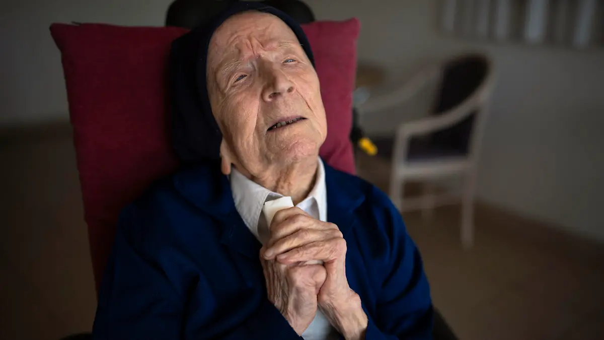 Sister Andre poses for a portrait at the Sainte Catherine Laboure care home in Toulon, southern France, Wednesday, April 27, 2022. With the death of Kane Tanaka at age 119, the world's oldest human is now Lucile Randon, a French nun known as Sister Andre, aged 118, according to the The Gerontology Research Group. (AP Photo/Daniel Cole)