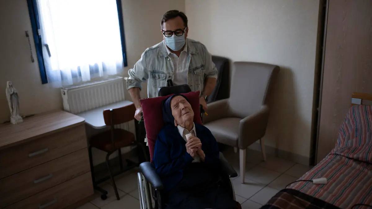 Sister Andre is pictured in her room at the Sainte Catherine Laboure care home in Toulon, southern France, Wednesday, April 27, 2022. With the death of Kane Tanaka at age 119, the world's oldest human is now Lucile Randon, a French nun known as Sister Andre, aged 118, according to the The Gerontology Research Group. (AP Photo/Daniel Cole)