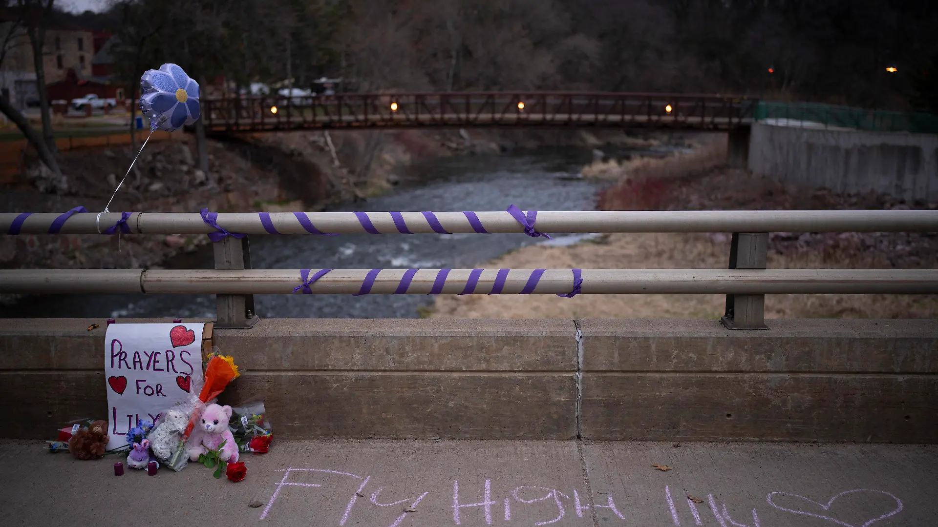A memorial for 10-year-old Iliana "Lily" Peters is displayed on Jefferson Ave. Monday evening, April 25, 2022, in Chippewa Falls, Wis. Peters was found dead in a park earlier in the day after being reported missing the night before. (Jeff Wheeler/Star Tribune via AP)