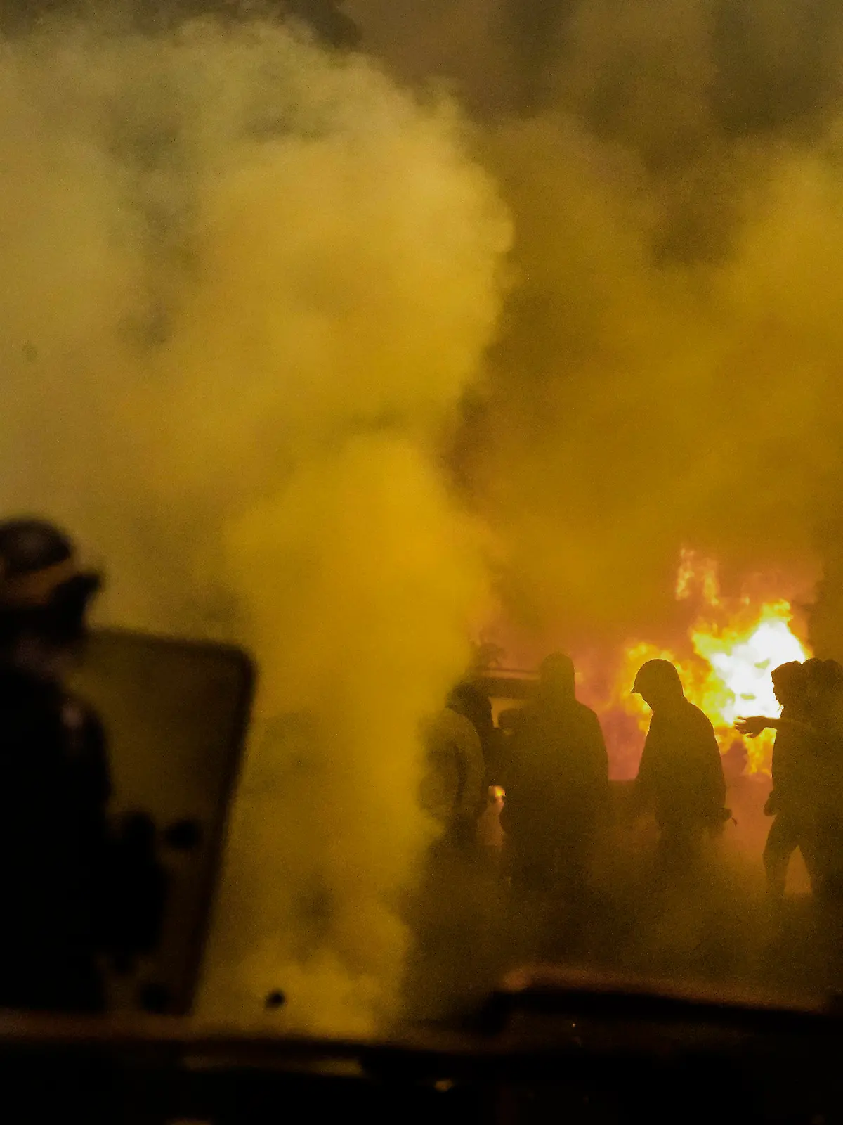 Police forces clash with youths in Nanterre, outside Paris, Thursday, June 29, 2023. French President Emmanuel Macron has described the killing of a 17-year-old delivery driver by police at a traffic check "inexcusable," and called for a thorough investigation. The death in the Paris suburb of Nanterre prompted scattered violence overnight. (AP Photo/Christophe Ena)