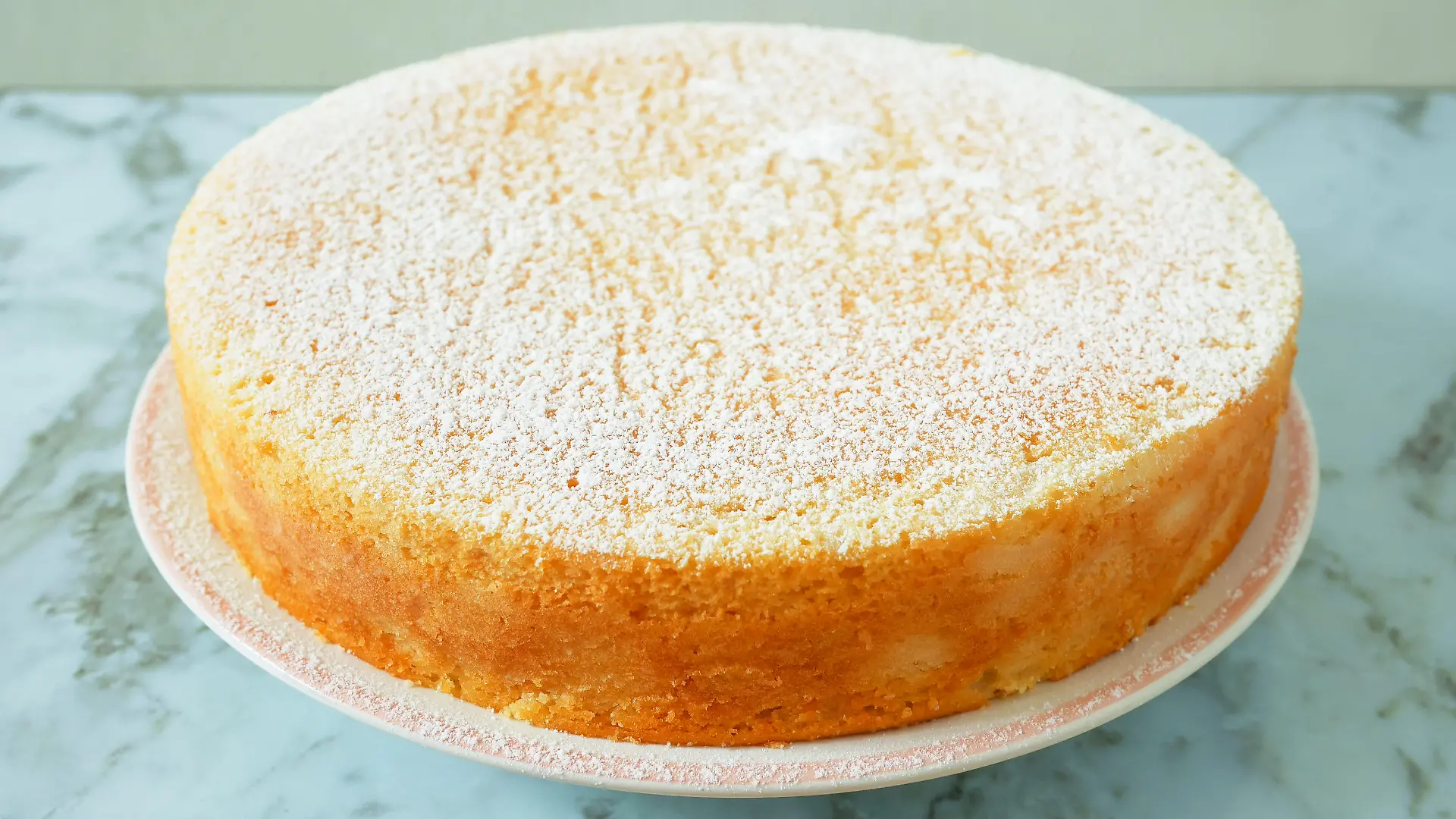 Homemade yogurt cake with icing sugar. Close up.