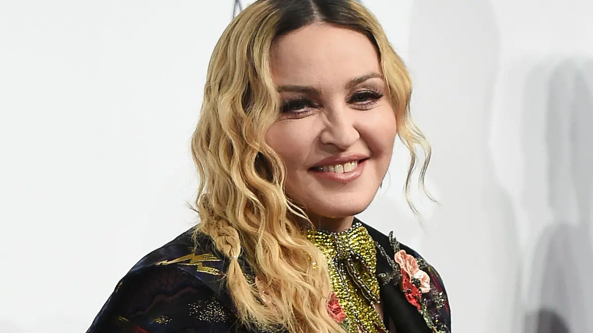 FILE - In this Dec. 9, 2016 file photo, Madonna attends the 11th Annual Billboard Women in Music honors in New York. Madonna will direct a biopic about herself for Universal Pictures. Madonna will direct and co-write with “Juno” screenwriter Diablo Cody. (Photo by Evan Agostini/Invision/AP, File)