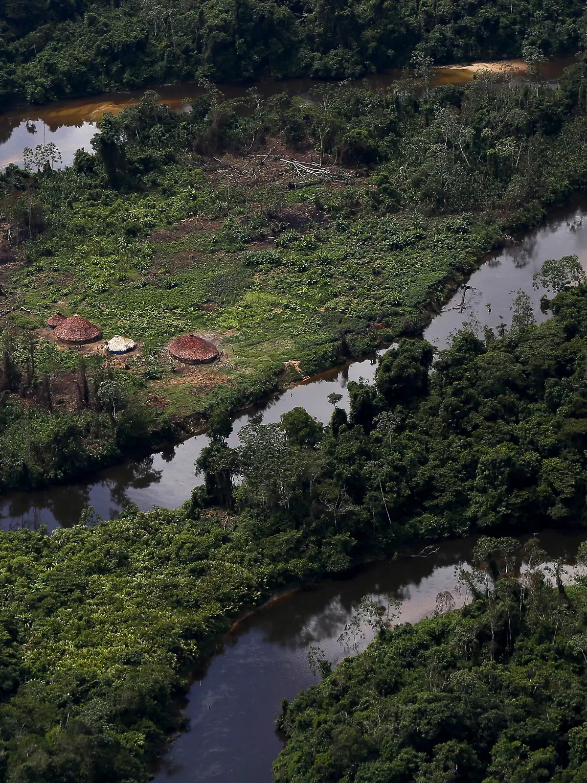 FILE PHOTO: A village of indigenous Yanomami is seen during Brazil’s environmental agency operation against illegal gold mining on indigenous land, in the heart of the Amazon rainforest, in Roraima state, Brazil April 18, 2016. Picture taken April 18, 2016. REUTERS/Bruno Kelly/File Photo