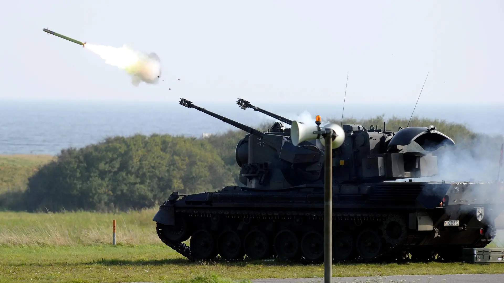 (dpa file) - A file picture dated 06 October 2010 shows a Gepard air defence tank firing a Stinger rocket at the firing range in Todendorf, Germany. On 12 March 2012, the Chief of Staff will decommission the German Army's air defence in Todendorf at the Baltic Sea. The squad's tasks will be performed by the German Air Force. Photo: Carsten Rehder