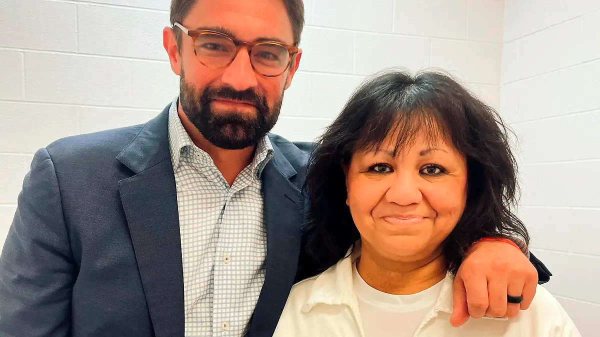 In this April 6, 2022 photo provided by Texas state Rep. Jeff Leach, Rep. Leach stands next to death row inmate Melissa Lucio during a visit by a group of seven lawmakers to the Mountain View Unit in Gatesville, Texas. The lawmakers visited Lucio to update her about their efforts to stop her April 27 execution. The lawmakers say they are troubled by Lucio’s case and believe her execution should be stopped as there are legitimate questions about whether she is guilty. (Texas state Rep. Jeff Leach via AP)