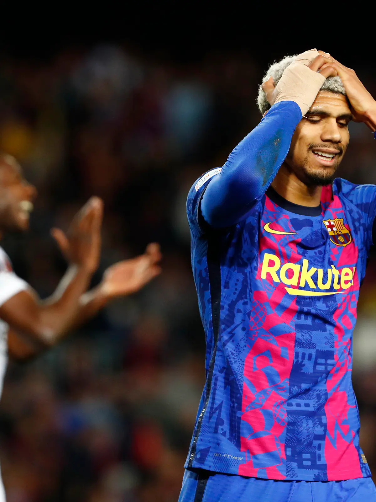 Barcelona's Ronald Araujo reacts after a missed scoring opportunity during the Europa League, second leg, quarterfinal soccer match between Barcelona and Eintracht Frankfurt at the Camp Nou stadium, in Barcelona, Spain, Thursday, April 14, 2022. (AP Photo/Joan Monfort)
