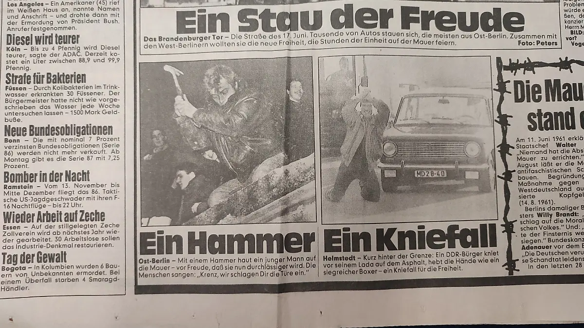 Ein Reporter fängt die Euphorie an der Grenze ein.