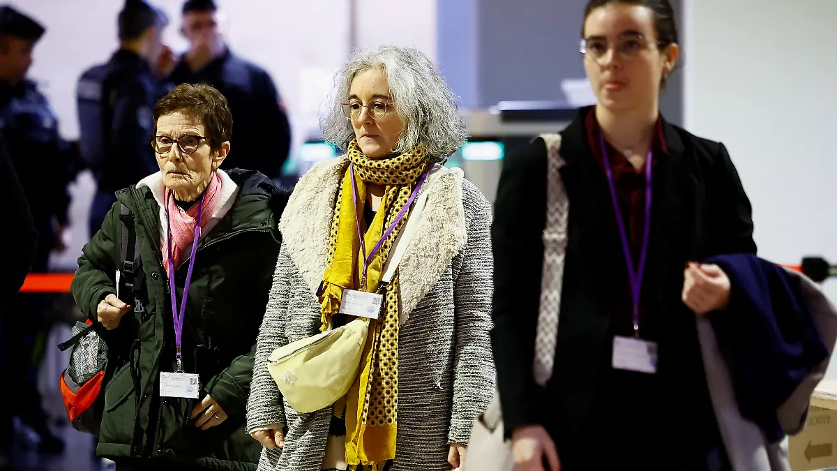 Bernadette Paty and Gaelle Paty, mother and sister of slain school teacher Samuel Paty, arrive to attend the trial of eight people accused of involvement in the beheading of French history teacher Samuel Paty by a suspected Islamist in 2020 in an attack outside his school in the Paris suburb of Conflans-Sainte-Honorine, at the Paris courthouse on the Ile de la Cite, in Paris, France, November 8, 2024. 
