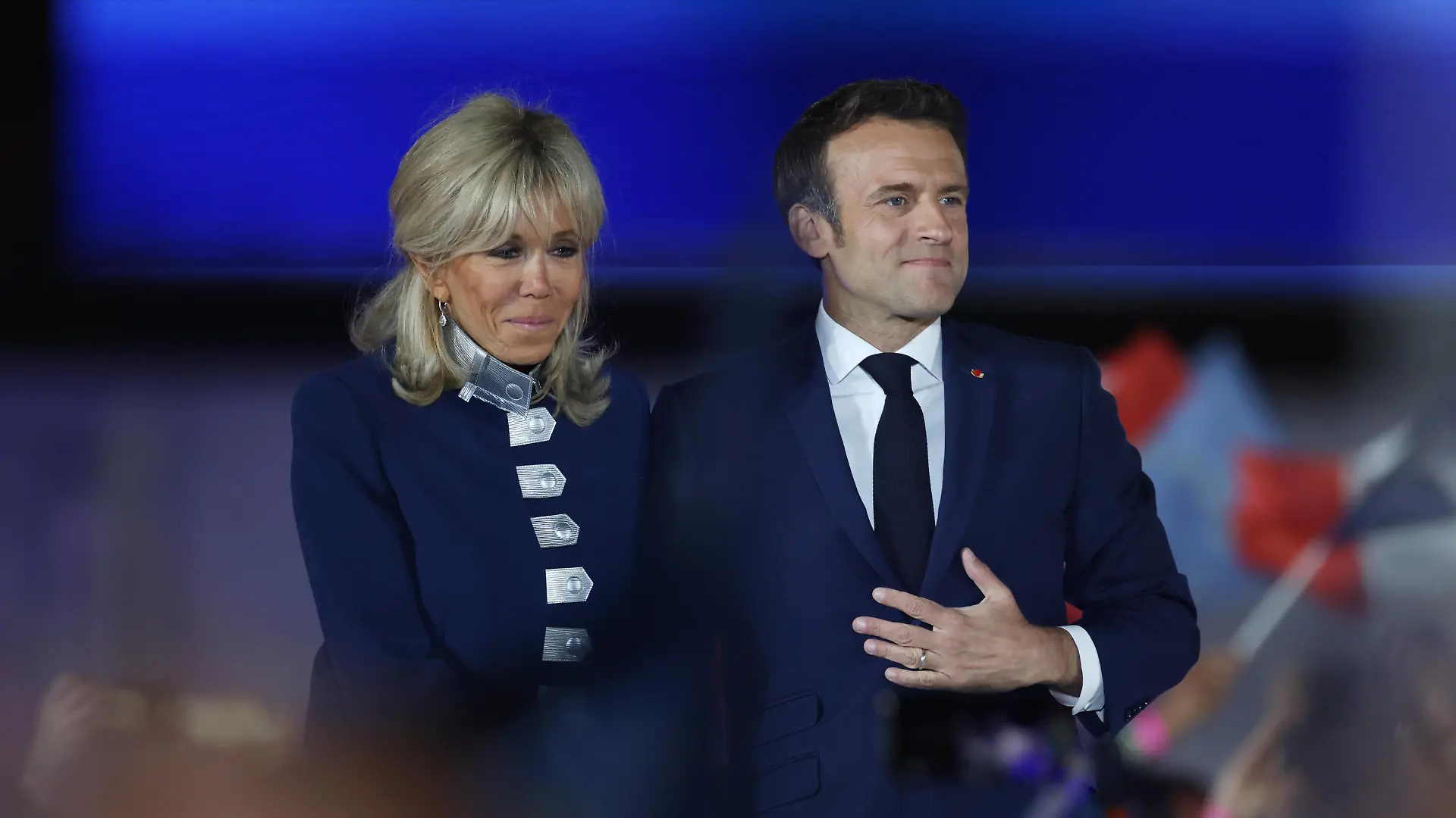 220424 -- PARIS, April 24, 2022 -- French incumbent President Emmanuel Macron R attends a rally after the presidential runoff in Paris, France, on April 24, 2022. French incumbent President Emmanuel Macron won the 2022 French presidential runoff with 58 percent of the votes, according to the preliminary exit poll released Sunday evening by French television BFMTV. Macron s rival, far-right wing candidate Marine Le Pen, gained 42 percent of the votes. FRANCE-PARIS-PRESIDENTIAL RUNOFF GaoxJing PUBLICATIONxNOTxINxCHN