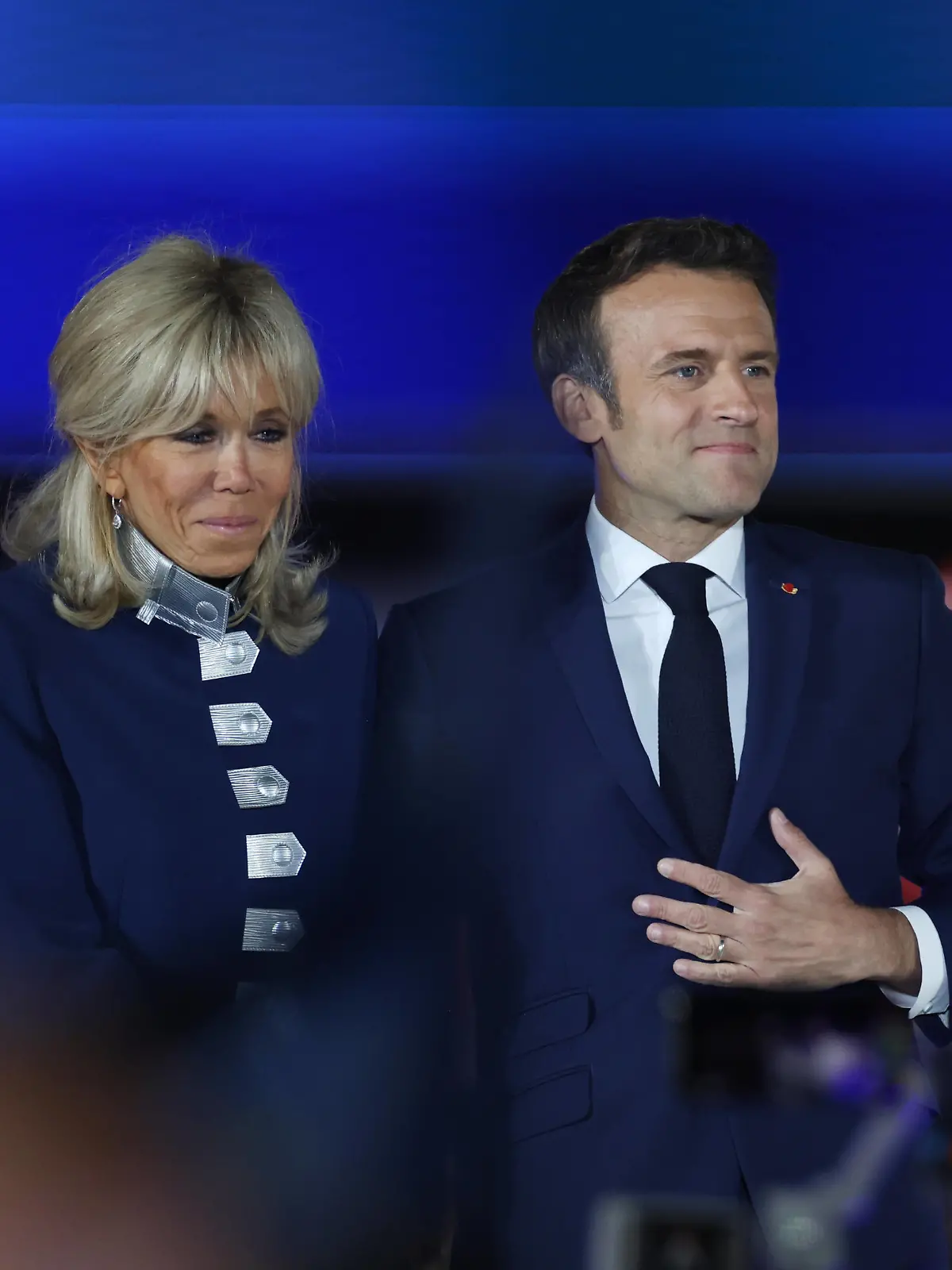  220424 -- PARIS, April 24, 2022 -- French incumbent President Emmanuel Macron R attends a rally after the presidential runoff in Paris, France, on April 24, 2022. French incumbent President Emmanuel Macron won the 2022 French presidential runoff with 58 percent of the votes, according to the preliminary exit poll released Sunday evening by French television BFMTV. Macron s rival, far-right wing candidate Marine Le Pen, gained 42 percent of the votes.  FRANCE-PARIS-PRESIDENTIAL RUNOFF GaoxJing PUBLICATIONxNOTxINxCHN
