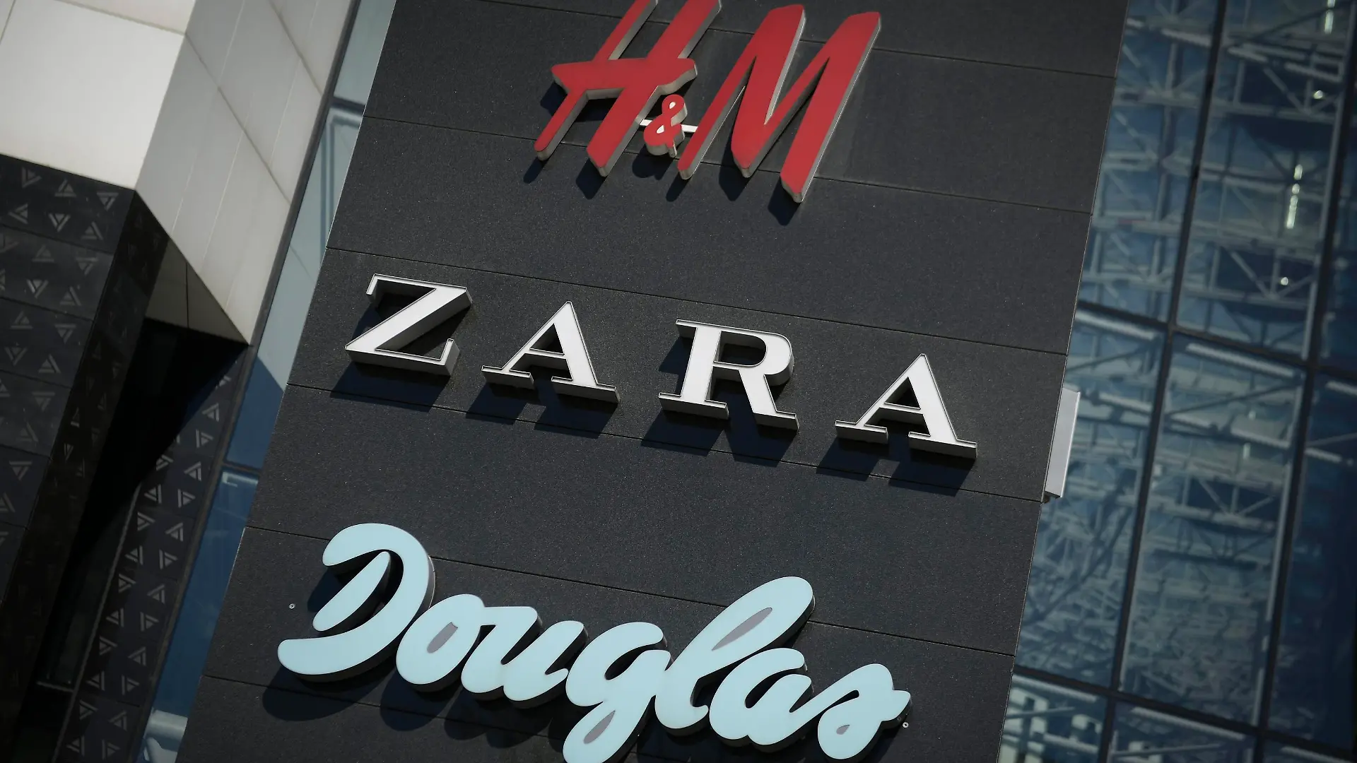 Shop logos are seen at the entrance of the Plac Unii shopping center in Warsaw, Poland on April 22, 2018. (Photo by Jaap Arriens/NurPhoto)