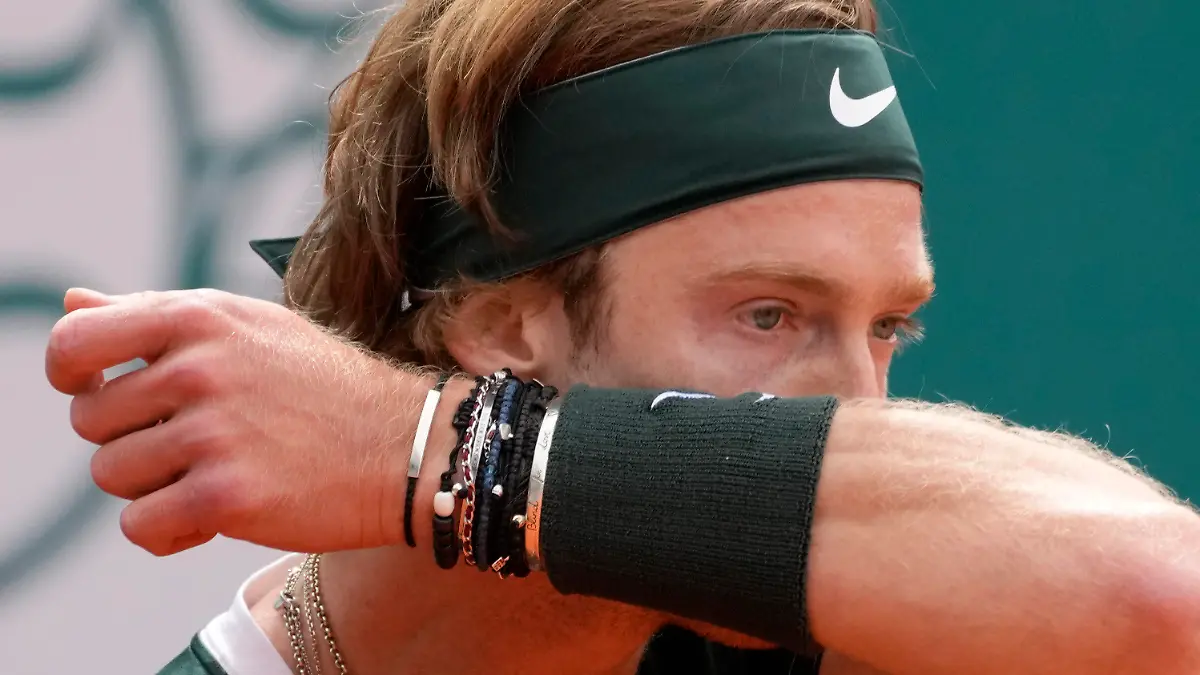 Andrey Rublev of Russia wipes his face during their final tennis match of the Serbia Open tennis tournament against Novak Djokovic of Serbia, in Belgrade, Serbia, Sunday, April 24, 2022. (AP Photo/Darko Vojinovic)