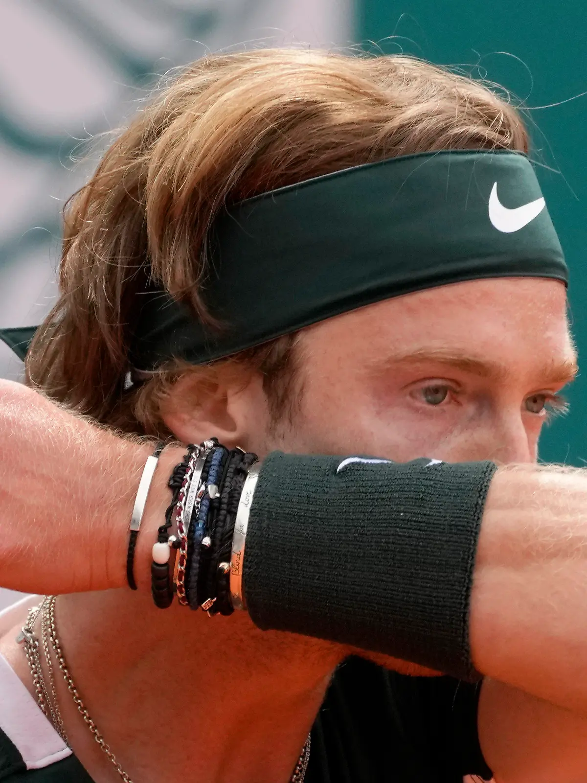 Andrey Rublev of Russia wipes his face during their final tennis match of the Serbia Open tennis tournament against Novak Djokovic of Serbia, in Belgrade, Serbia, Sunday, April 24, 2022. (AP Photo/Darko Vojinovic)