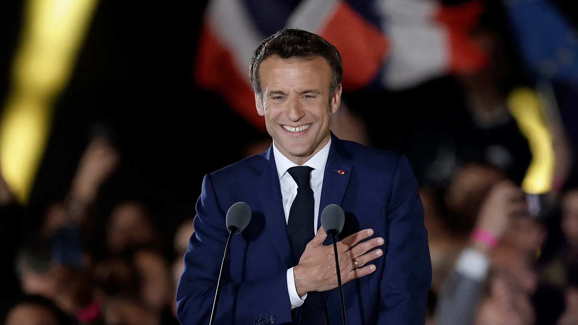French President Emmanuel Macron gestures as he arrives to deliver a speech after being re-elected as president, following the results in the second round of the 2022 French presidential election, during his victory rally at the Champs de Mars in Paris, France, April 24, 2022. REUTERS/Benoit Tessier