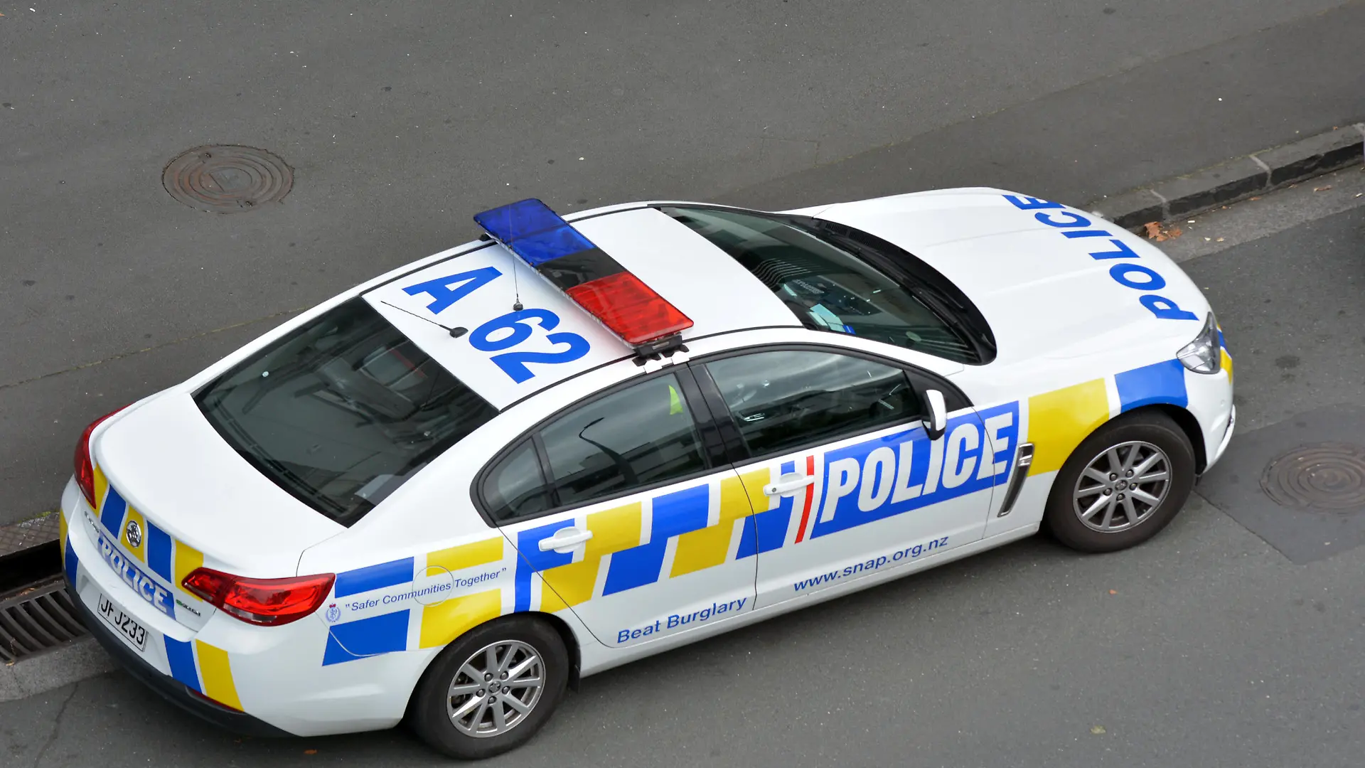 AUCKLAND - MAR 30 2017:New Zealand Police car and officer during a crime respond in Auckland, New Zealand.