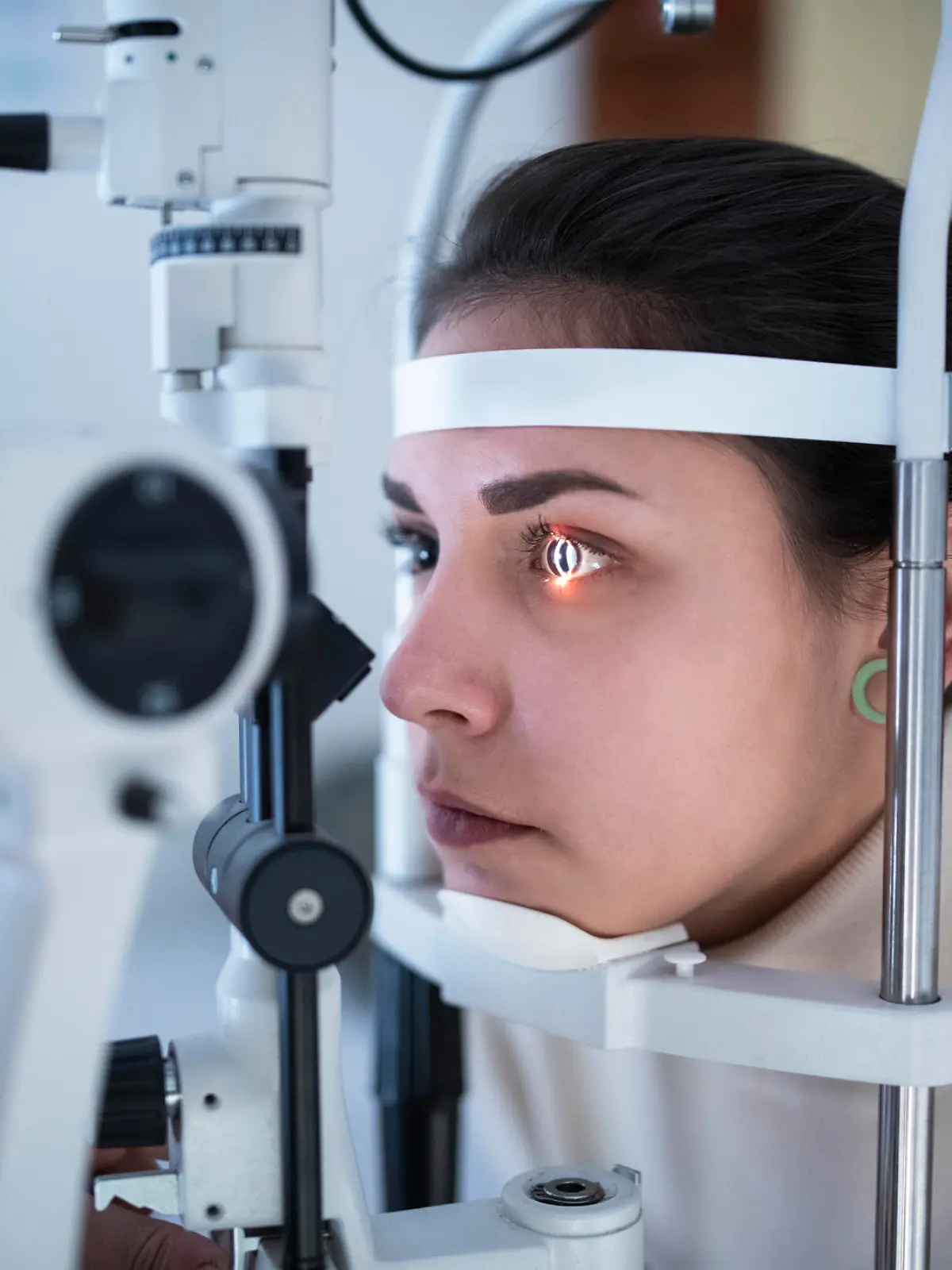 Close up of woman having eye tested in specialized hospital.