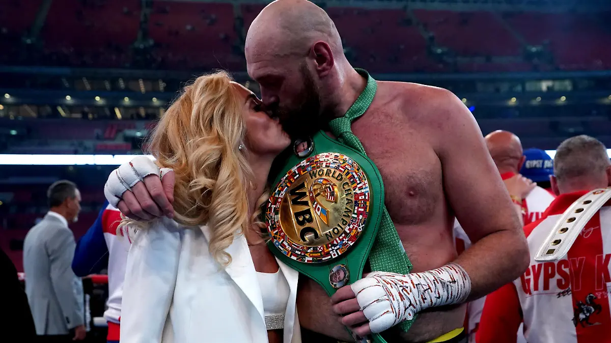 Tyson Fury v Dillian Whyte - Wembley Stadium. Tyson Fury with his wife Paris following victory over Dillian Whyte at Wembley Stadium, London. Picture date: Saturday April 23, 2022. See PA story BOXING London. Photo credit should read: Nick Potts/PA Wire. RESTRICTIONS: Use subject to restrictions. Editorial use only, no commercial use without prior consent from rights holder. URN:66528035