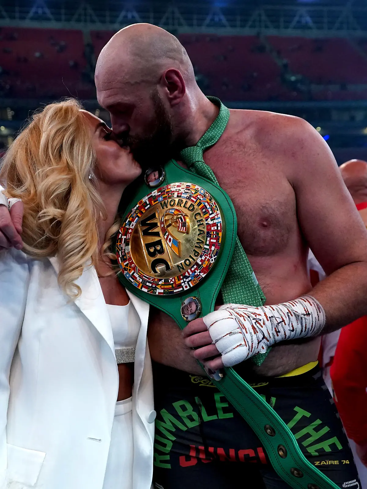 Tyson Fury v Dillian Whyte - Wembley Stadium. Tyson Fury with his wife Paris following victory over Dillian Whyte at Wembley Stadium, London. Picture date: Saturday April 23, 2022. See PA story BOXING London. Photo credit should read: Nick Potts/PA Wire. RESTRICTIONS: Use subject to restrictions. Editorial use only, no commercial use without prior consent from rights holder. URN:66528035