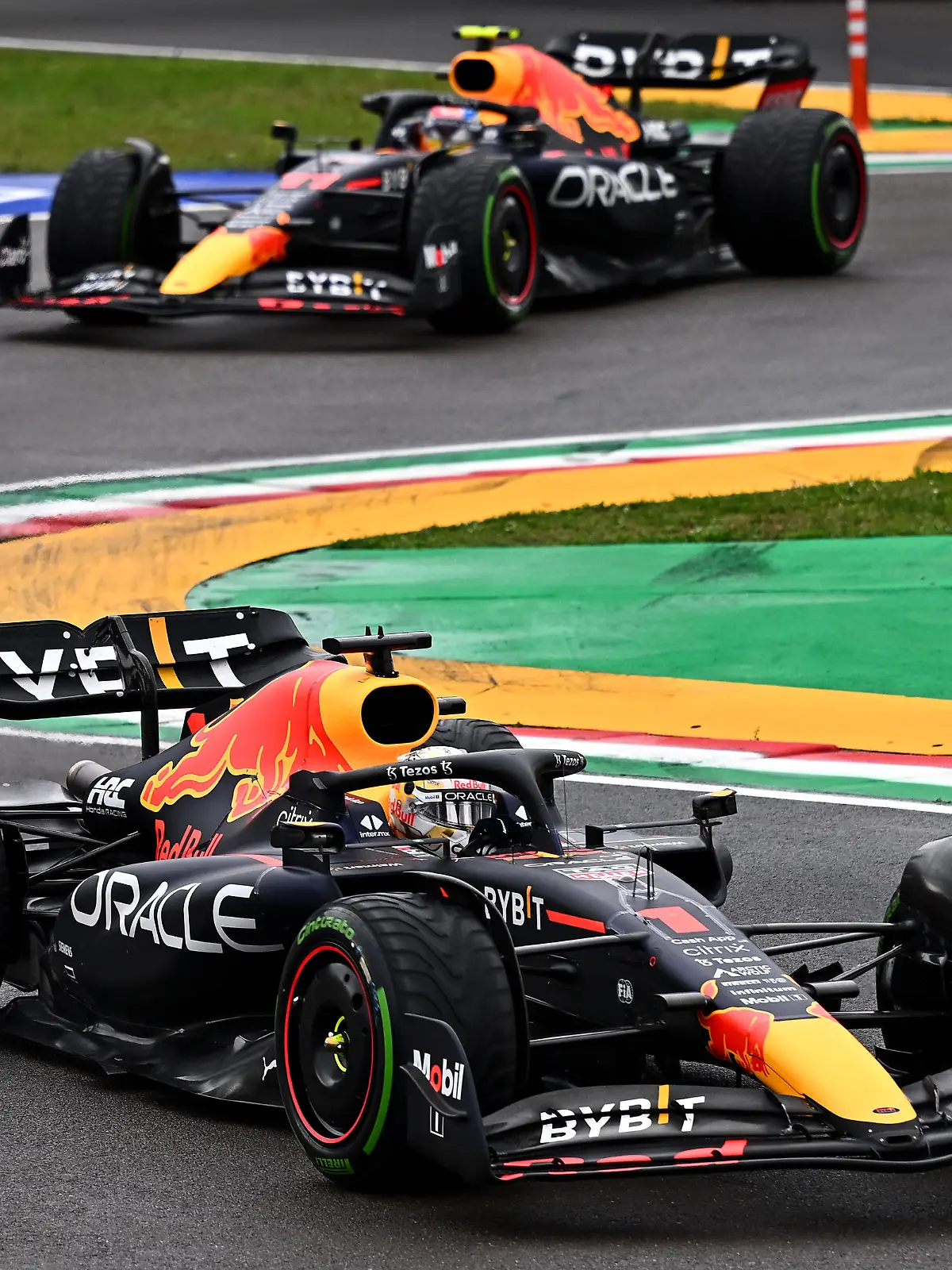 IMOLA, ITALY - APRIL 24: Max Verstappen of the Netherlands driving the (1) Oracle Red Bull Racing RB18 leads Sergio Perez of Mexico driving the (11) Oracle Red Bull Racing RB18 during the F1 Grand Prix of Emilia Romagna at Autodromo Enzo e Dino Ferrari on April 24, 2022 in Imola, Italy. (Photo by Clive Mason/Getty Images)