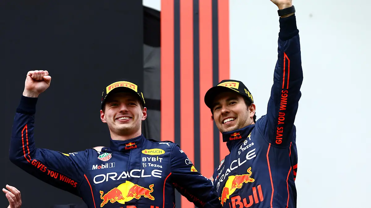 IMOLA, ITALY - APRIL 24: Race winner Max Verstappen of the Netherlands and Oracle Red Bull Racing and Second placed Sergio Perez of Mexico and Oracle Red Bull Racing celebrate on the podium during the F1 Grand Prix of Emilia Romagna at Autodromo Enzo e Dino Ferrari on April 24, 2022 in Imola, Italy. (Photo by Mark Thompson/Getty Images)